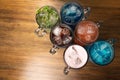 Colorful toned cocktails on wooden background. Frutal alcoholic cocktails. Colorful drinks concept Royalty Free Stock Photo