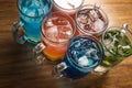 Colorful toned cocktails on wooden background. Frutal alcoholic cocktails. Colorful drinks concept Royalty Free Stock Photo