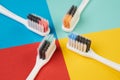 Colorful toothbrushes on four colored background Royalty Free Stock Photo