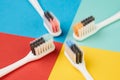 Colorful toothbrushes on four colored background Royalty Free Stock Photo