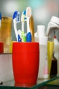 Colorful toothbrushes in a glass Royalty Free Stock Photo