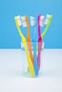 Colorful toothbrushes in a water glass Royalty Free Stock Photo