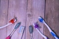 Colorful toothbrushes on a wooden background. Royalty Free Stock Photo