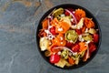 Colorful tortellini pasta salad overhead view on dark slate Royalty Free Stock Photo