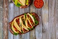 Colorful tortillas with beans, beef and vegetable. Mexican food