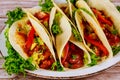 Colorful tortillas with beans, beef and vegetable with salsa