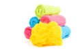 Colorful towel rolls with yellow bath sponge Royalty Free Stock Photo