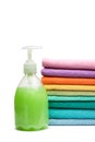 Colorful towels and liquid soap isolated Royalty Free Stock Photo