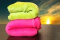 Colorful towels prepared for sunset bath in the sea