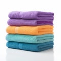 Colorful Towels Stacked On White Background - Vibrant And Playful