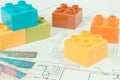 Colorful toy blocks, polish currency money and construction housing plan. Building, buying or renting home concept Royalty Free Stock Photo