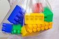 Colorful toy bricks, blocks for constructing and building in a plastic bag, package