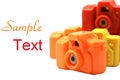 Colorful Toy Cameras with copy space Royalty Free Stock Photo