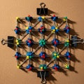 Colorful toy construction model on a brown cork board. Features interlocking plastic Royalty Free Stock Photo