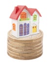 Colorful toy house on stack of euro coins Royalty Free Stock Photo