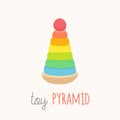 Colorful toy pyramids with clown heads in red funny hat. Cute toy clowns smiling.Classic ring stacker with a fun design