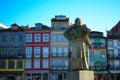 Colorful traditional apartments and statue of a man in Porto Portugal Royalty Free Stock Photo