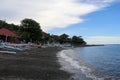 Colorful traditional Balinese fishing boats called jukungs on the volcanic beach of Amed, Bali, Indonesia Royalty Free Stock Photo