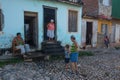 Colorful Traditional Colonial Caribbean town people with classic house and wall in Trinidad street, Cuba, America. Royalty Free Stock Photo