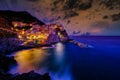 Colorful traditional houses on the rock over Mediterranean sea on dramatic sunset, Manarola, Cinque Terre, Italy Royalty Free Stock Photo