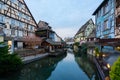 Colorful traditional old french houses on the side of canal Lauch at the evening in Petite Venise, Colmar, ribeauville, France. Royalty Free Stock Photo