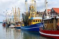 Colorful traditional old german fishing cutter boats moored Neuharlingersiel harbor Wadden sea East Frisia Northern Royalty Free Stock Photo