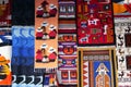 Colorful traditional woven carpets for sale at Otavalo market in Ecuador. Native South American woven fabric
