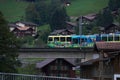 Colorful train around the nature and buildings of Switzerland