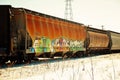 Colorful train on snowy tracks in the winter