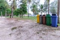 colorful trashcan at forest seaside