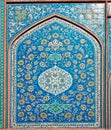 Colorful tree and flower patterns on the old tile of the historical wall of an iranian building in Isfahan, Iran.