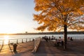 Pier 84 at Hudson River Park during a Fall Sunset with Colorful Trees in Hell`s Kitchen of New York City