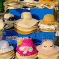 Colorful trendy female summer sun straw hats for sale in beach shop in Dubai. Assortment hats Royalty Free Stock Photo