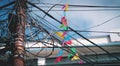 Colorful Triangle Flag on Electrical Wire Cable Tangled and Chaos at Thamel Street, Kathmandu, Nepal Royalty Free Stock Photo
