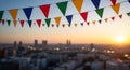 Colorful Triangle Flags Hanging Over Cityscape During Sunset Royalty Free Stock Photo