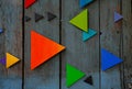 Colorful triangles on wooden surface