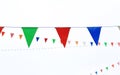 Colorful triangular Flags Hanging in the white sky outdoor Royalty Free Stock Photo