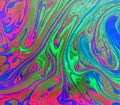 Colorful, trippy green, blue and pink psychedelic abstract background