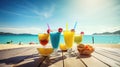 Colorful tropical cocktails on the beach with sea and blue sky background amd fruits on the table Royalty Free Stock Photo