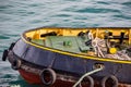 Colorful tugboat bow in Greek harbor, partial view