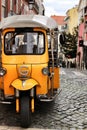 Colorful Tuk-Tuk parked in a Lisbon street