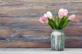 Colorful tulips flowers on wooden table. Top view with copy space. Toned picture Royalty Free Stock Photo