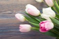 Colorful tulips flowers on wooden table. Top view with copy space. Toned picture by instagram filter Royalty Free Stock Photo