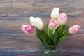 Colorful tulips flowers on wooden table. Top view with copy space. Toned picture by instagram filter Royalty Free Stock Photo