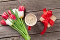 Colorful tulips, gift box and red coffee cup Royalty Free Stock Photo