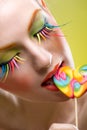 Colorful twisted lollipop and colorful extreme fashion makeup