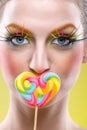 Colorful twisted lollipop and colorful fashion makeup