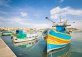 Colorful typical boats at harbour Marsaxlokk in Malta