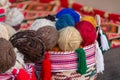 Colorful traditional thread for knitting, many clews in basket