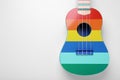 Colorful ukulele on white background, top view and space for text. String musical instrument